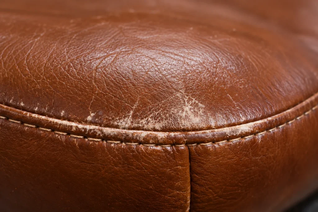 Office chair close-up: worn seat edge