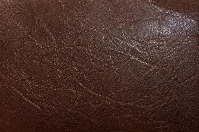 Close view of brown leather grain matched after a repair
