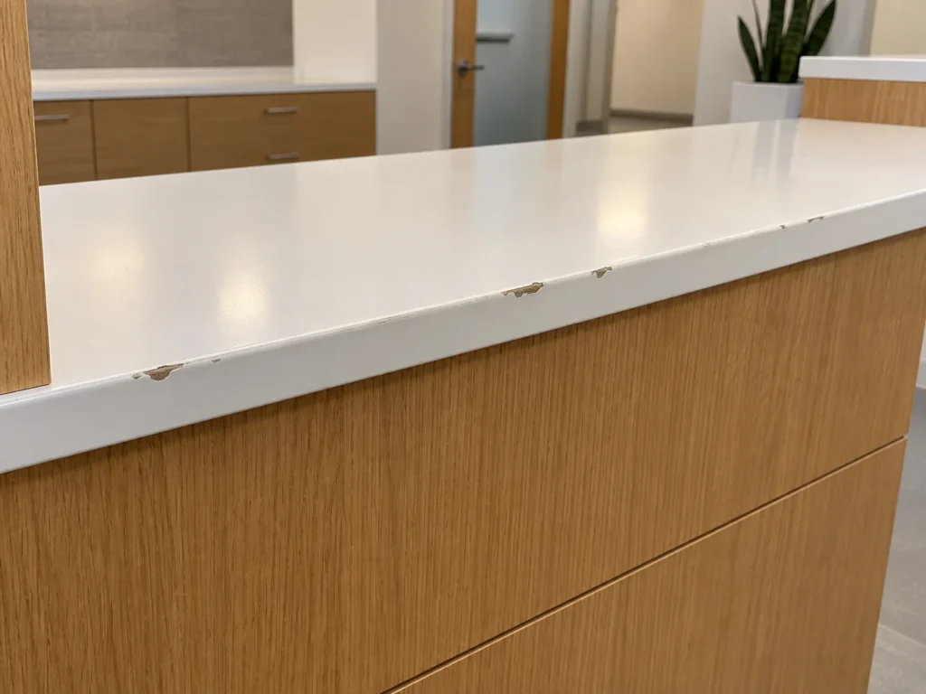 A desk edge before repair