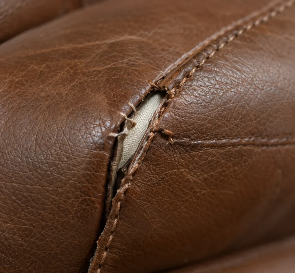 Split seams on a leather ottoman