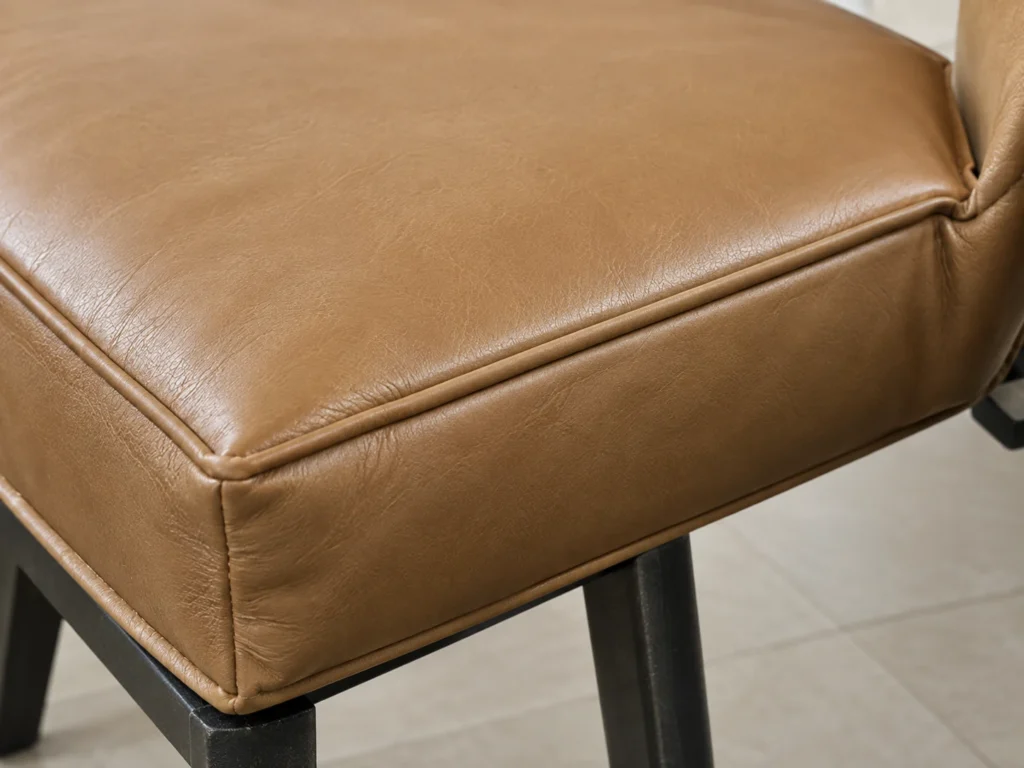 Store-bought seat pad sliding off a chair it was not made for