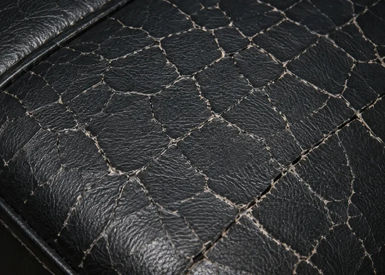 A vinyl seat panel that has hardened and cracked
