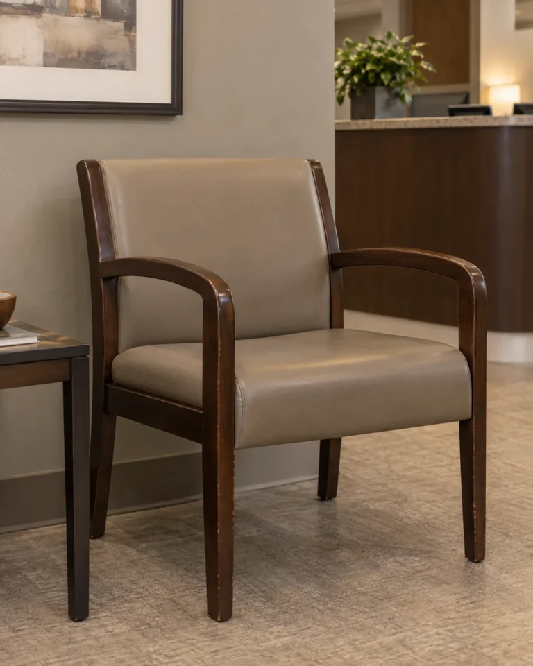 A wood-framed guest chair in a waiting area